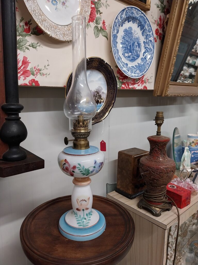 Antique French Hand Painted Milk Glass Boudoir Oil Lamp Circa 1900. Measures 22" high including globe, on 6" base
