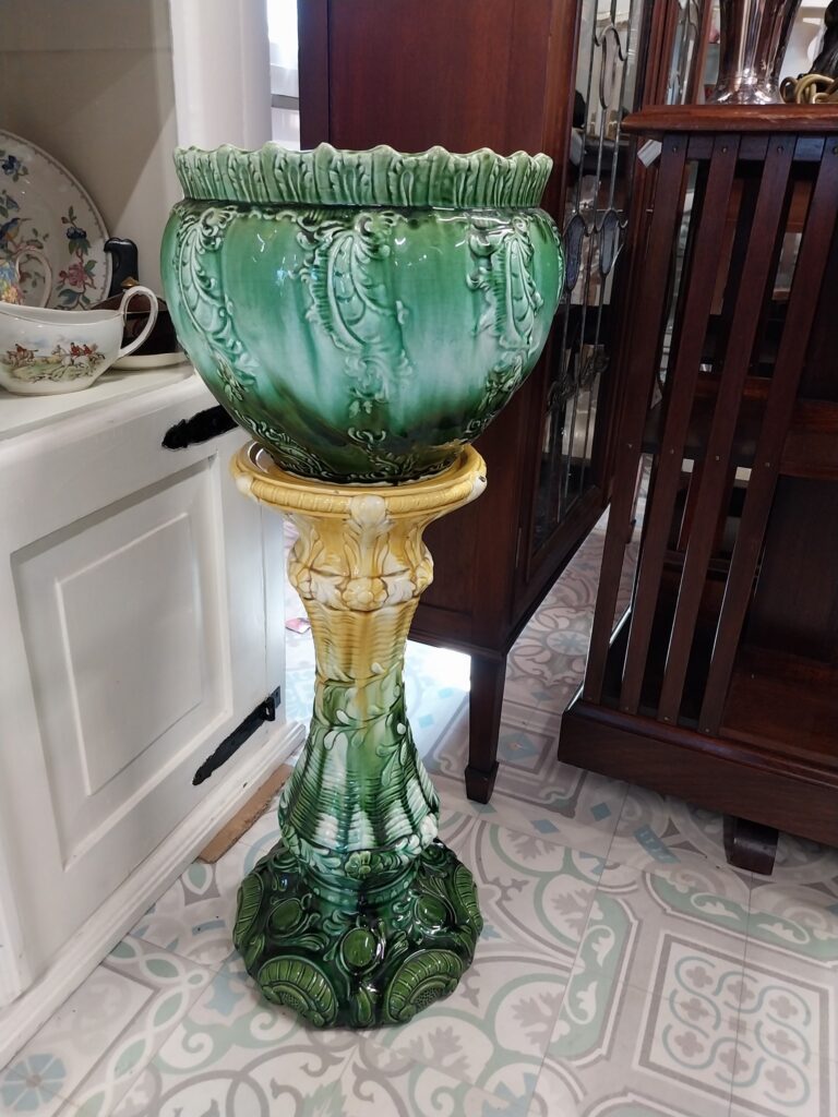 Victorian Majolica Jardiner and Stand circa 1890. Jardiner measures 10" high by 11"
wide. Stand 21.5" high on 14" base