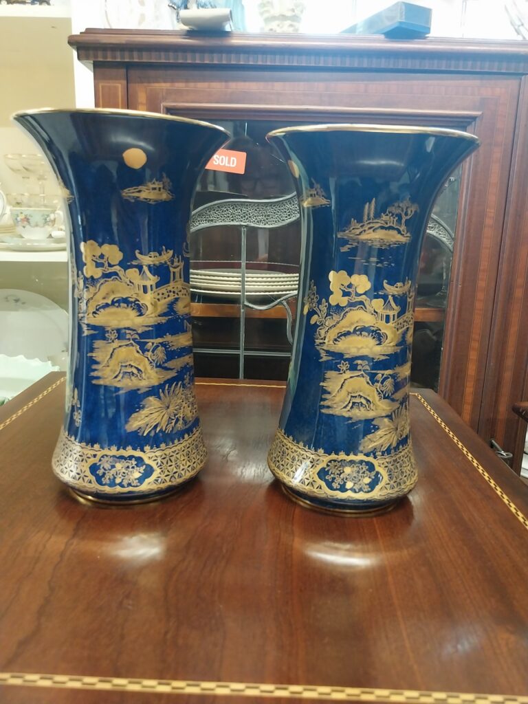 Pair of 1930s Cobalt Blue with Hand Painted Gilt Pattern from Wilton Ware. Measure 9.5"  high by 5.5" wide. Excellent condition.