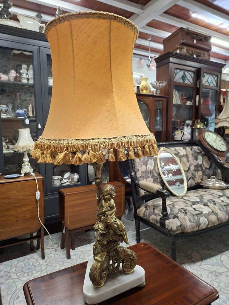 Mid-century Italian Brass and Marble Cherub Table
Lamp. Measures 32" high on 9" base. Original shade. Beautiful condition. €160
