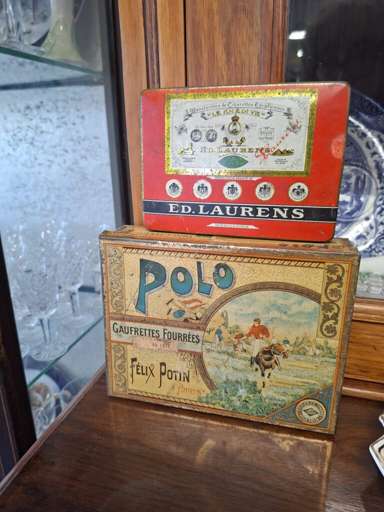 Two French Advertising Tin Boxes c.1920s/30s. Very good condition.
Polo box 7.5" by 8.5" €24
Ed Lauren's 6" by 4" €20