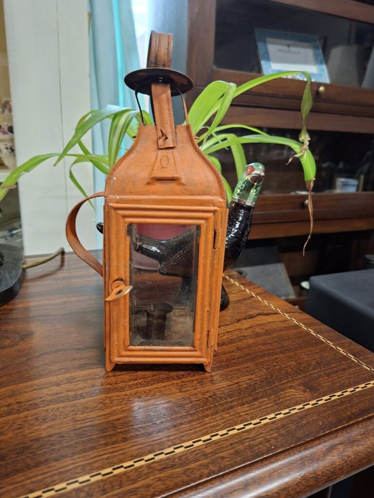 Antique French Farm House Single Candle Tin Lantern. Circa 1880s/1900. Glass Panels on 3 sides, loop on top for hanging. Handle to side for carrying. In Good condition. Measures 11" base 3" €39