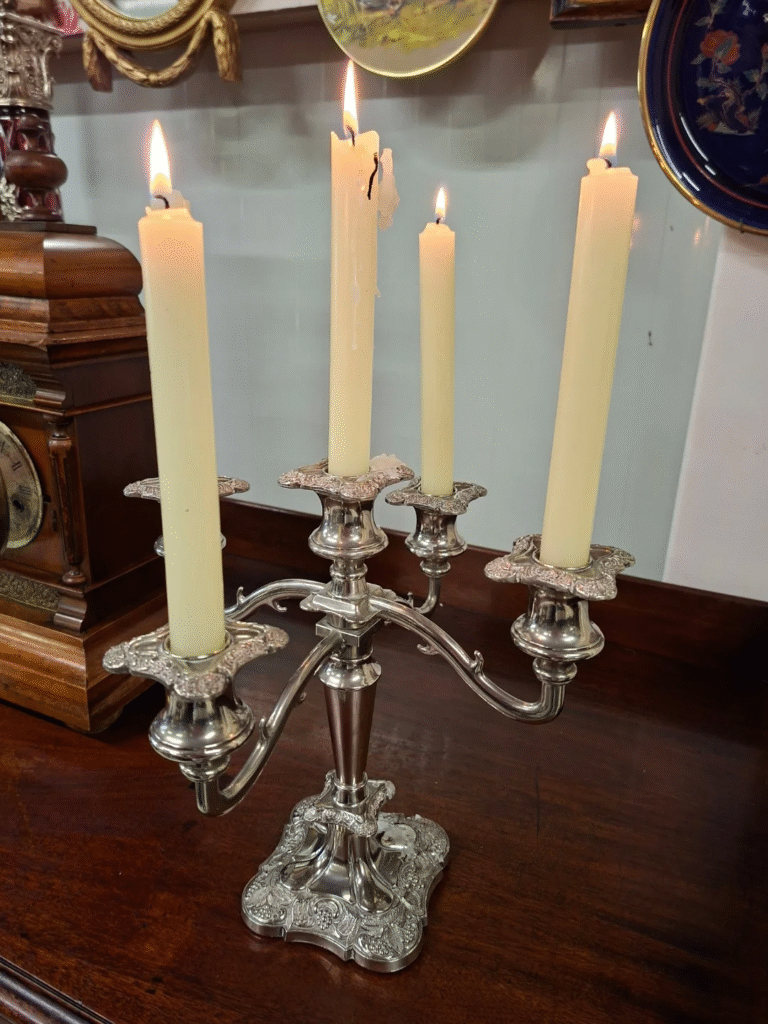 Vintage Silver-Plate English 5 Arm Candelabra. Nice grape motif design. Excellent Condition. No wear to plate. Measures 10.5" high by 11" wide on base 5" square €58