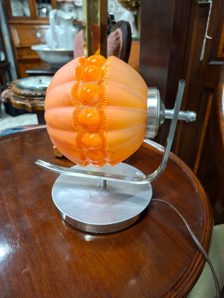 1960s/70s Chrome with Peach glass shade table lamp. Possibly Eastern European or Italian. Very good condition. Measures 8.5" wide by 8.5" high