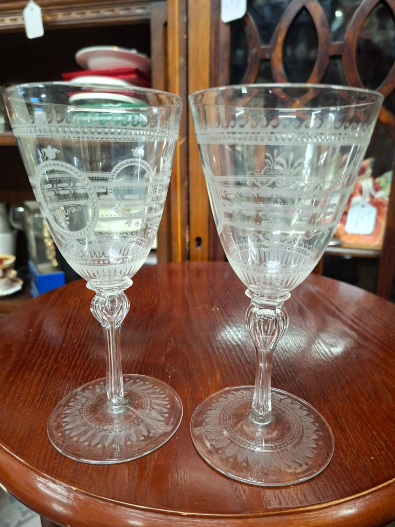 Pair of Edwardian Etched White Wine
Glasses, with Tear Drop Stem. 7" high on etched base 3.5"