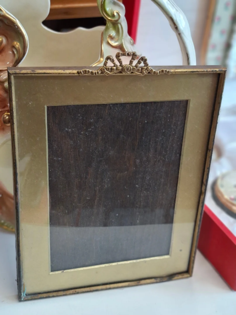 Antique circa 1920s Picture Frame. Gilded metal with wooden Back. Frame measures 8" by 10" Photo space 6" by 8" €25