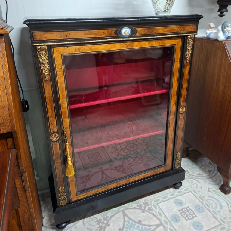 Antique Ormolu Mount Pier Cabinet. Ebonised with walnut inset and Painted Oval. Red velvet interior. Very good condition.  Measures 31" wide, 12" deep by 42" high.