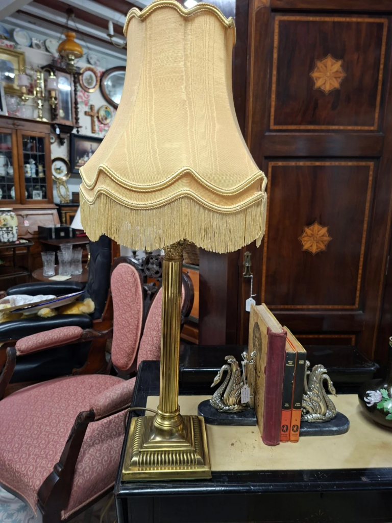 Vintage Mid-century Corinthian Column Brass Table Lamp with Double Scalloped Gold Fabric Shade.
Measures 32" high including shade on 6.5" base. In very good condition.