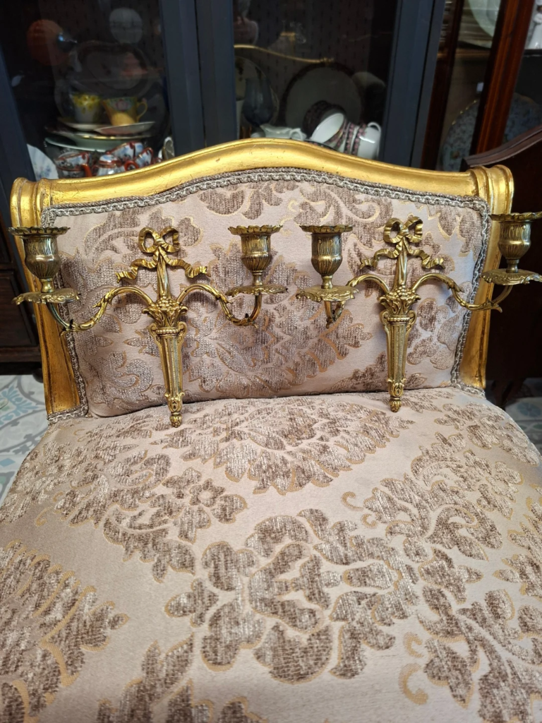 Pair of Mid-Century continental brass candle sconces. Excellent condition.  Measures 9" wide by 7.5" high
